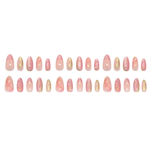 Pink press-on nails with golden starburst, cat-eye shimmer and 3D textured accents