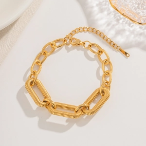 18k gold plated stainless steel chunky chain bracelet with twist texture on white background
