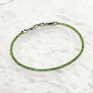 Tennis bracelet with emerald green crystals and silver stainless steel adjustable clasp