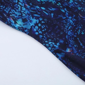 Detail of dark blue mesh fabric with abstract star sky pattern and breathable texture