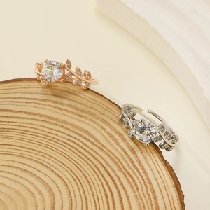 Leaf vine ring with cubic zirconia and large center stone in silver and rose gold