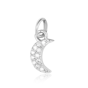 Macro shot of silver crescent moon pendant with cubic zirconia micro-pave setting