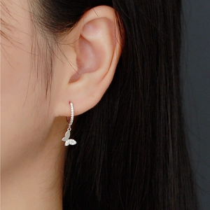 Close-up of S925 sterling silver butterfly hoop earrings with sparkling zircon stones