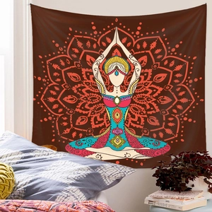 Vertical yoga meditation tapestry with mandala print on brown wall in a cozy bedroom