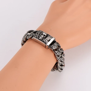 Vintage oxidized stainless steel skull bracelet with intricate totem carvings for men