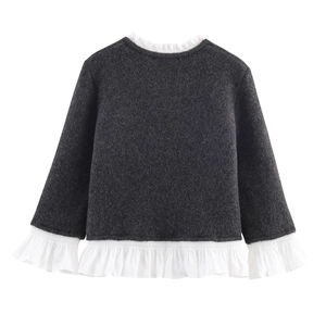 Dark grey knitted cardigan with white poplin trim and layered ruffle details