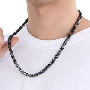 Detail of gunmetal Byzantine chain bracelet for men with street style weave on wrist