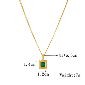 Detail view of gold necklace with green gemstone pendant showing 41+6.5cm chain length