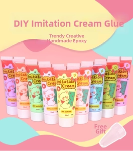 Macro detail of various colorful 50g DIY cream glue tubes with nozzles and cartoon patterns