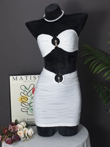 Women's white two-piece striped set with metal ring details and backless crop top