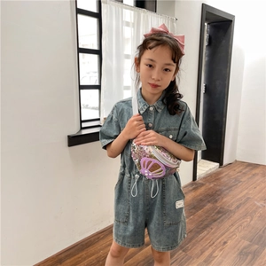 Iridescent sequin girls' shell crossbody bag with pearls worn on denim outfit