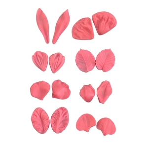 Pink silicone petal leaf fondant molds set for cake decorating on white background