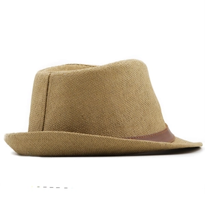 Detailed side view of straw fedora hat featuring woven texture and brown leather band