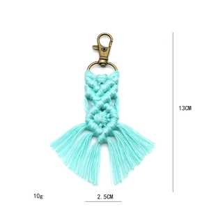 Detail of teal braided cotton rope keychain with vintage metal clasp and size markings