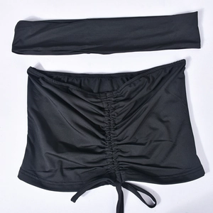 Flat lay of black ruched bandeau crop top with drawstring and matching headband set