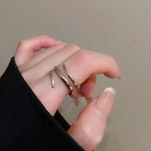 Detailed view of silver minimalist multi-layer spiral ring with polished finish