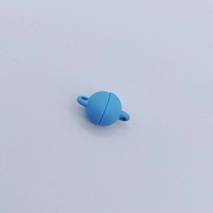 Close-up of a sky blue spherical magnetic clasp for DIY jewelry making accessories