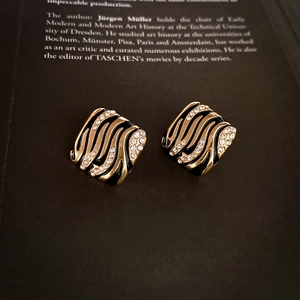 Vintage gold square stud earrings with black enamel waves and sparkling crystals