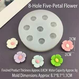 Vue détaillée d'un moule en silicone camélia avec des fleurs colorées de 2 cm de diamètre