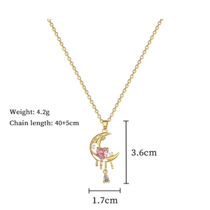 Detailed view of moon necklace dimensions with pink heart and crystal measurements