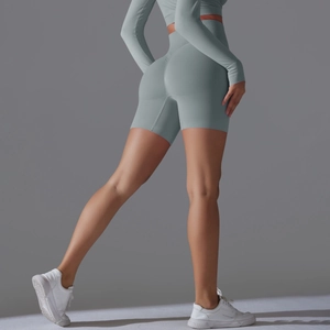 Detail of high waisted seamless yoga shorts with push-up effect and ribbed texture