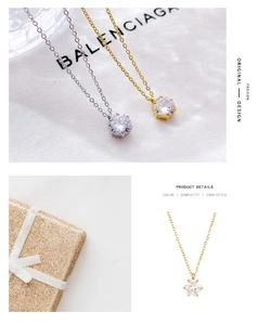 Macro shot of silver and gold necklaces with round-cut crystals in six-prong setting