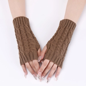 Macro detail of brown cable-knit texture on winter fingerless knitted arm warmers