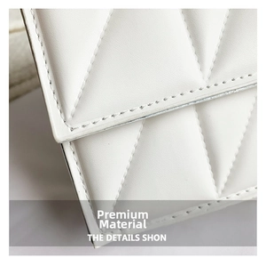 Close-up of premium white quilted leather texture and neat stitching on chain crossbody bag