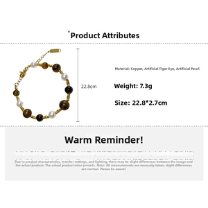 Detail view of pearl and tiger eye beaded bracelet showing size and material specifications