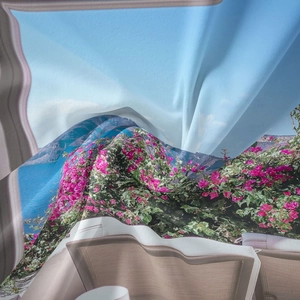 Detailed view of bohemian tapestry fabric with Mediterranean floral landscape print