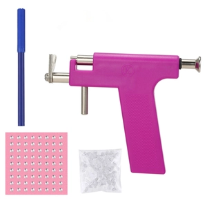 Detail view of purple ear piercing tool kit with 81 silver studs and a blue marker pen