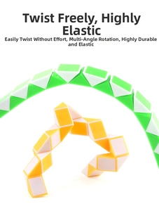 Flexible green and yellow snake cubes twisted into complex curves and heart shapes