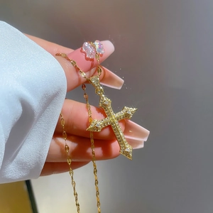 Gothic 18K gold plated cross necklace with sparkling zircon stones on a fine chain