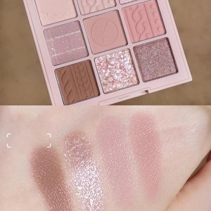 Nine-color eyeshadow palette close-up with arm swatches in matte and shimmer shades