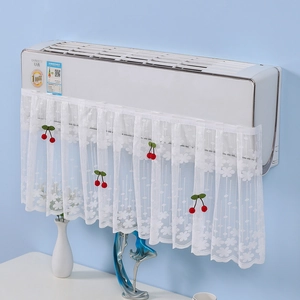 Detail of white lace air conditioner cover with cherry charms and floral embroidery