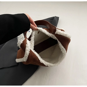 Internal view of the brown plush tote bag with soft white lining and spacious compartment