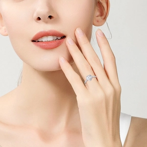 Sparkling heart-cut moissanite engagement ring in 925 sterling silver on model finger