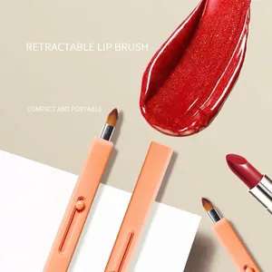 Portable retractable lip brush with pink matte handle and automatic sealing lid