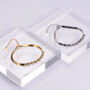 Detail of 18k gold plated stainless steel snake chains with inlaid sparkling zircons