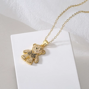 Gold plated teddy bear necklace with micro-paved black and white cubic zirconia crystals