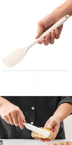 Detail of cream silicone spatula with built-in steel core for mixing and butter spreading