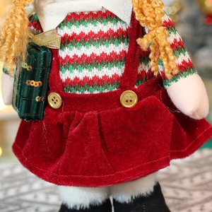 Charming Christmas elf doll in red velvet dress and green knit sweater for holiday decor