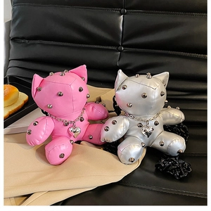 Pink and silver cat-shaped crossbody bags with metallic studs and heart pendants