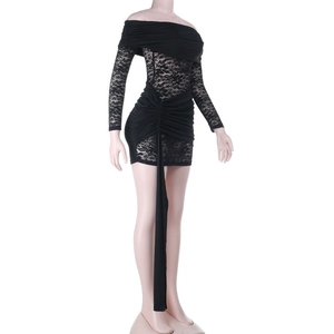 Detail of off-shoulder lace splicing and waist ribbon on a slim fit black dress