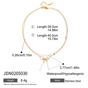 Detailed dimensions of bow pendant necklace with double chain and pearl accents