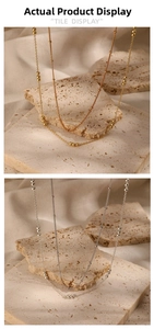 Detailed view of minimalist S925 sterling silver layered necklaces in gold and silver
