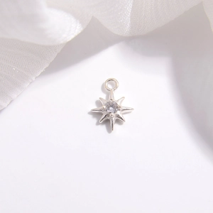 Macro shot of S925 sterling silver star pendant with cubic zirconia and metal jump ring
