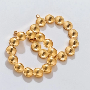 Hammered gold geometric circle earrings with textured round metallic disc charms