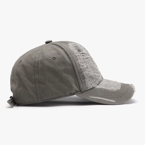 Distressed grey cotton baseball cap with vintage washed finish and torn fabric details