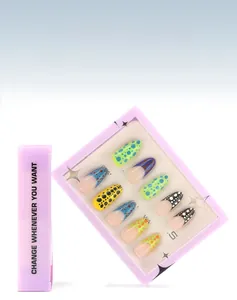 Detailed view of colorful polka dot French tips press-on nails in purple window box